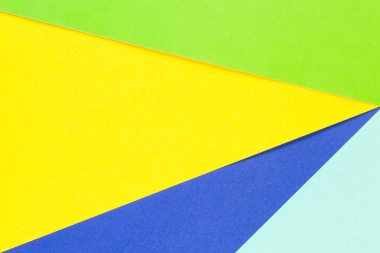 Renkli kağıtları geometri düz kompozisyon arka plan sarı, yeşil ve mavi tonlar