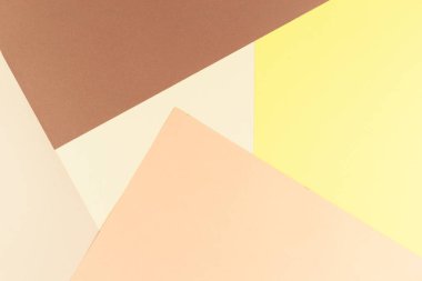 Renkli yumuşak kahverengi, bej ve sarı kağıt arka plan.