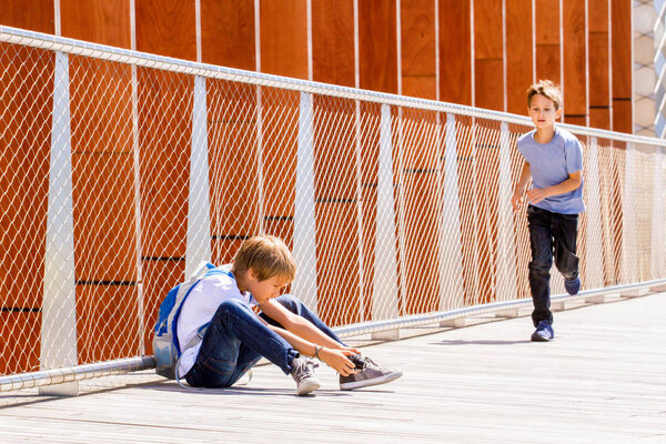 Boy making video or photo with digital camera outdoors