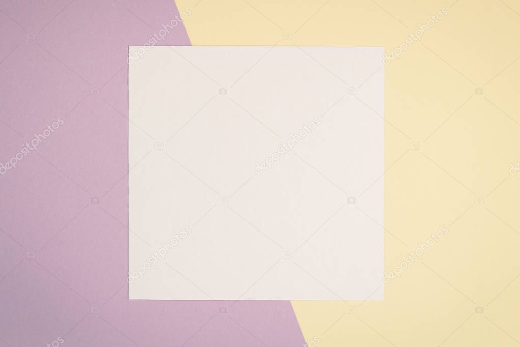 Blank white card on colorful background with copy space