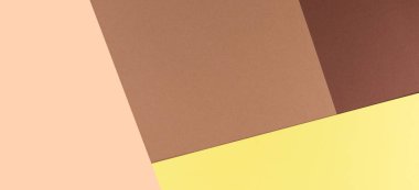 Renkli yumuşak kahverengi, bej ve sarı kağıt arka plan.