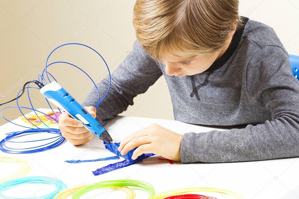 Focused child with 3d printing pen creating a plane