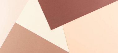 Renkli yumuşak kahverengi, bej ve sarı kağıt arka plan.