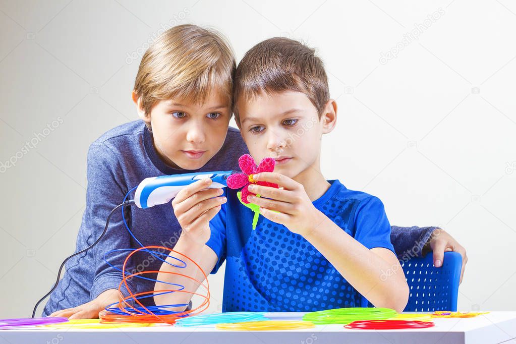 Children creating with 3d printing pen
