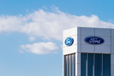 Finestrat, Spain - November 14, 2017: Ford motor company logo on dealership building on November 14, 2017 in Finestrat, Alicante province, Spain. clipart