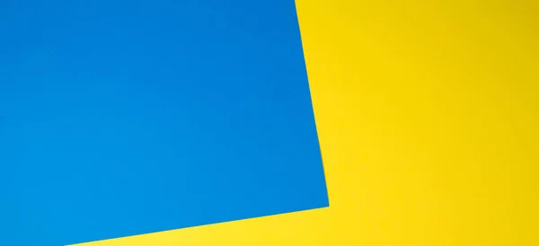 Papeles de color geometría fondo de composición plana con tonos amarillos y azules — Foto de Stock