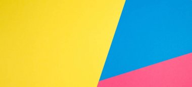 Renk kağıtları geometri düz kompozisyon arka plan sarı, pembe ve mavi tonlar