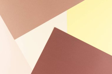 Renkli yumuşak kahverengi, bej ve sarı kağıt arka plan.