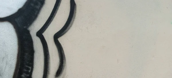 Graffiti bianco .Grey nero intonaco parete frammento con astratto urbano street art modello sfondo . — Foto Stock