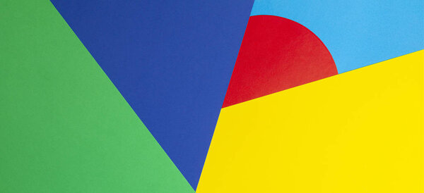 Abstract geometric shape yelllow, blue, red, green color paper background