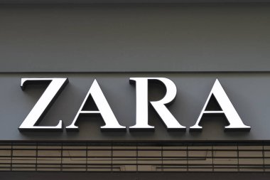 Valencia, Spain - January 02, 2020: Zara logo sign on shop entrance in Valencia, Spain. Zara is popular Spanish clothing and accessories retailer