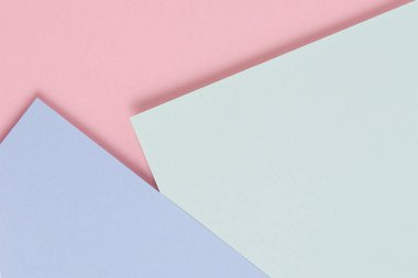 Soyut renkli kağıt dokusu arkaplanı. Pastel pembe, açık mavi ve yeşil renkte minimal geometrik şekiller ve çizgiler