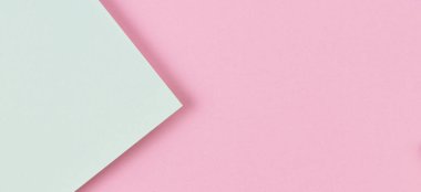 Soyut renkli kağıt dokusu arkaplanı. Pastel pembe ve açık yeşil renklerde minimum geometrik şekiller ve çizgiler