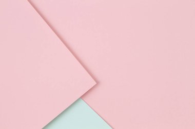 Soyut renkli kağıt dokusu arkaplanı. Pastel pembe ve açık yeşil renklerde minimum geometrik şekiller ve çizgiler