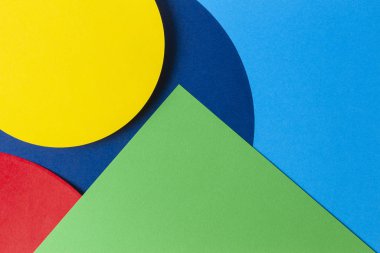Abstract colored paper texture background. Minimal geometric shapes and lines in light blue, navy, red, green and yellow colors