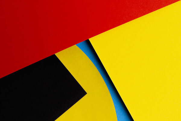 Abstract colored paper texture background. Minimal geometric shapes and lines in red, yellow, black, light blue colors