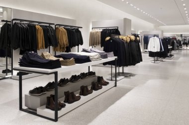 Modern fashionable brand interior of men clothing shop store inside shopping center