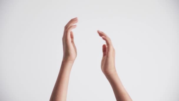 Kid hands clapping applause and showing two thumbs up gesture over white background — Stock Video