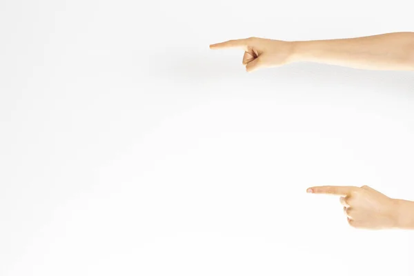 Dos manos señalando con el dedo índice sobre fondo blanco de la pared — Foto de Stock