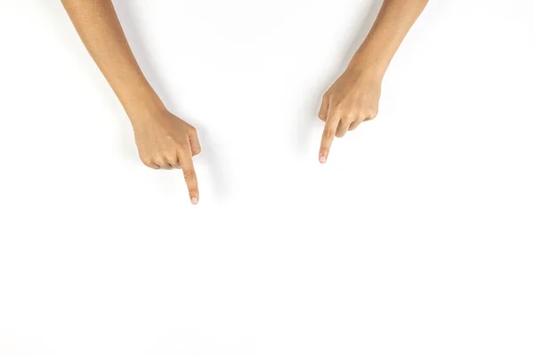 Manos de niño apuntando hacia abajo con los dedos a algo sobre fondo blanco — Foto de Stock