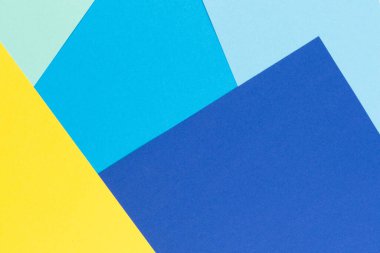 Soyut renk kağıtları geometri düz kompozisyon arkaplan sarı ve mavi tonlu