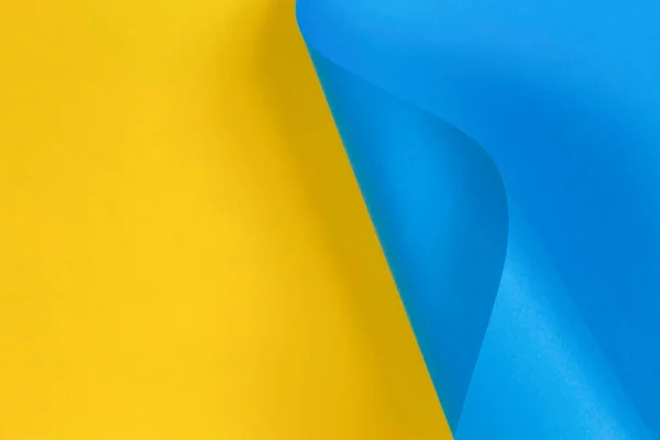 Forma geométrica abstracta pastel azul y amarillo fondo de papel de color — Foto de Stock
