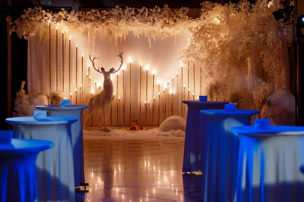 beautiful New Years photo zone is decorated with artificial snow, winter trees