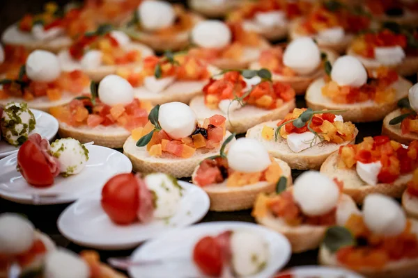 Buffet tables with various canapes appetizers buffet sandwiches for the holidays Stock Picture