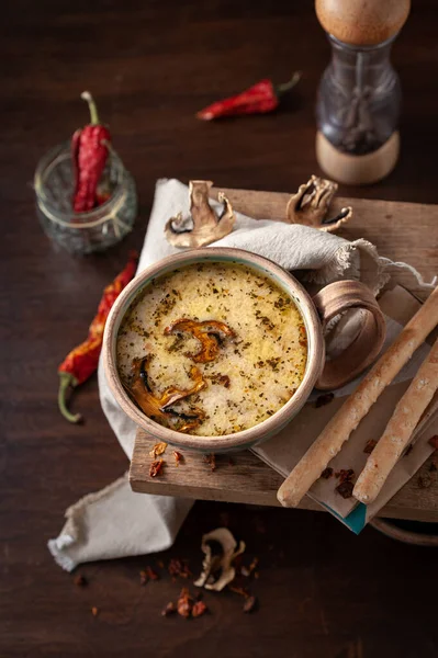 Cream soup with mushrooms in a beautiful serving with bread sticks — Stock Image Cream Soup Mushrooms Beautiful Serving Bread Sticks Royalty Free Stock Images