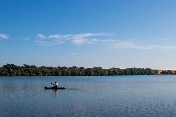 Canoe fisherman lake