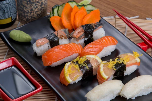 Sashimi and sushi rolls — Stock Photo, Image