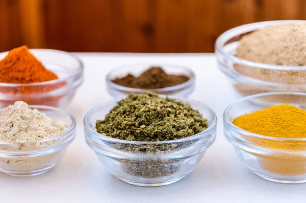 Variety of spices powder in glass bowls
