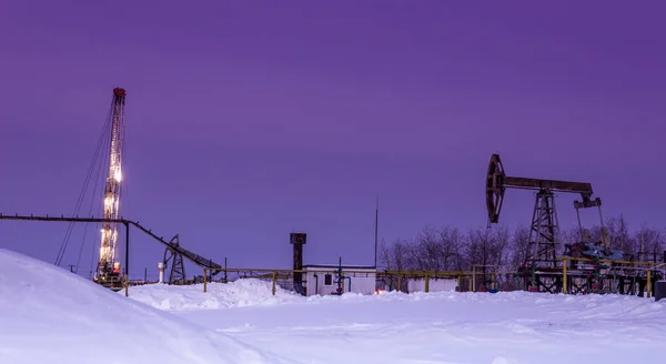 Oilfield in winter night time — Stock Photo, Image