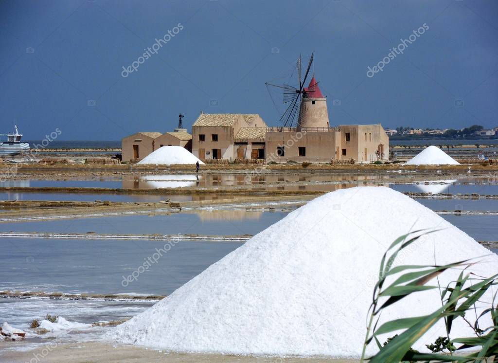 Marsala, Sicily, Italy - July 30, 2010: heaps of salt in the salt marshes of the lagoon