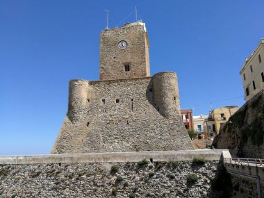 Termoli, Molise, Italy - July 28, 2017: The Swabian castle at the entrance of the Ancient Village seen from the Colombo promenade clipart