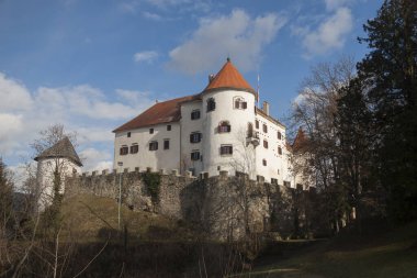 Velenje castle above the city of Velenje in Slovenia. Beautiful historical castle building is one of the cultural landmarks of Slovenia. clipart