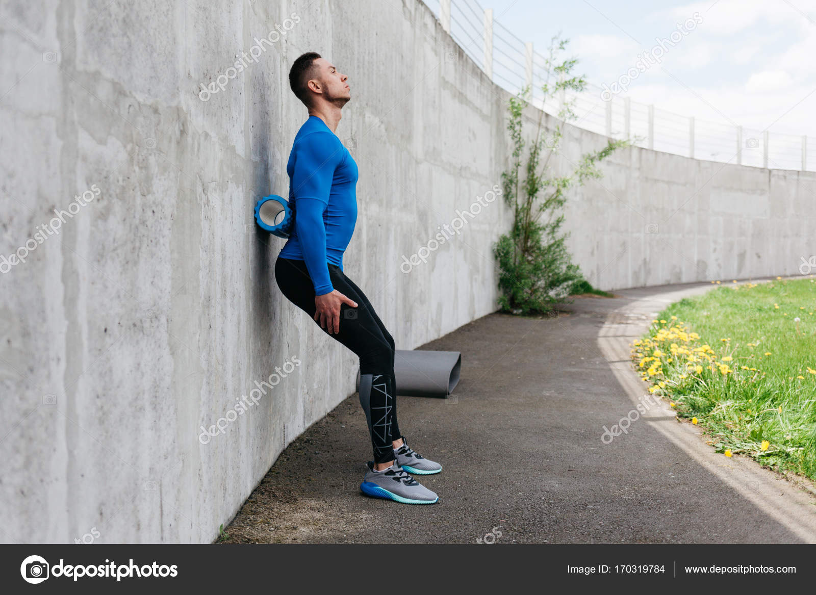 Handsome guy with foam roller — Stock Photo © romanlisovy 170319784