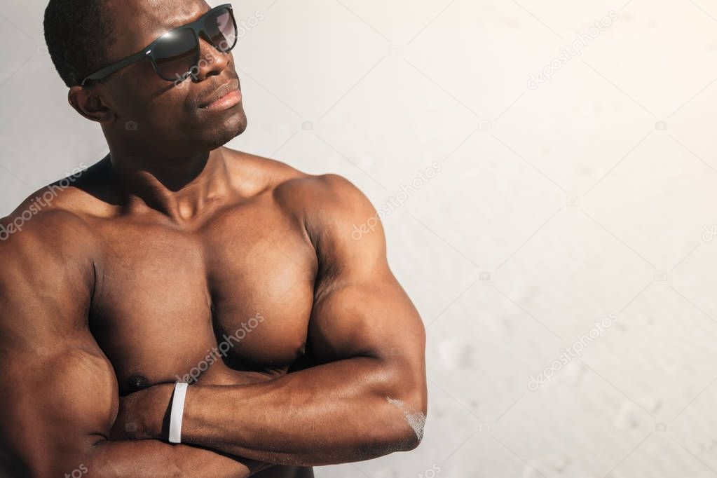 muscular man with arms crossed