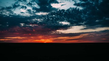 Sunset landscape upon the field
