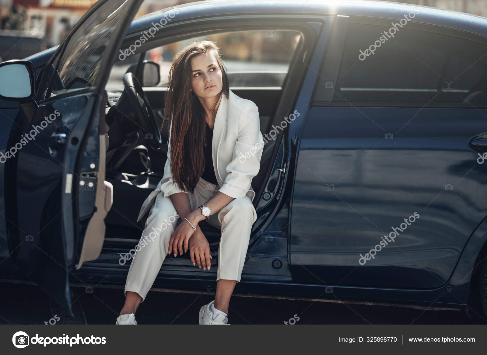 Portrait stylish model child. Beautiful teenager in blue sweater. Fashion  pose model. Young hipster girl sitting chair, looking at camera confident,  defiant. Studio shot. hands on face. Stock Photo | Adobe Stock