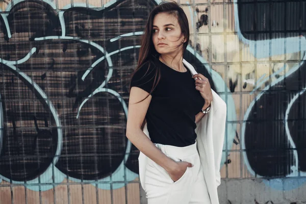Portrait of Fashion Stylish Girl in White Suit Posing Near the Graffiti Wall — Stock Photo, Image