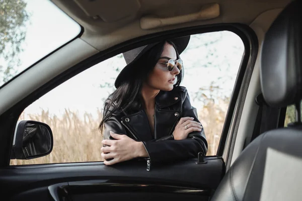 Portrait of Happy Traveling Girl Enjoying a Car Trip on the Field Road