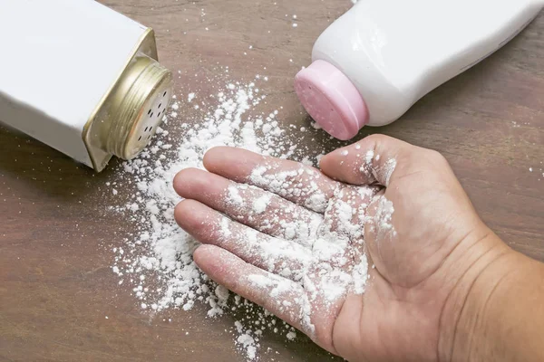 White talcum powder in hand — Stock Photo, Image