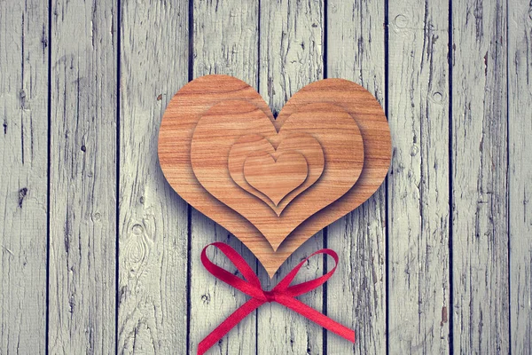 Wooden heart on wood background — Stock Photo, Image