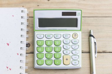 hesap makinesi, defter, kalem