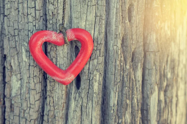 Heart-shaped hanging on wooden — Stock Photo, Image