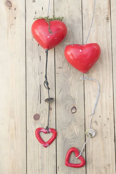 Heart-shaped hanging on wooden — Stock Photo, Image
