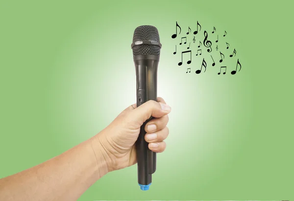 Mão masculina com microfone — Fotografia de Stock