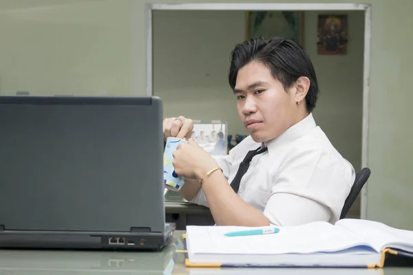 asian business man watching laptop