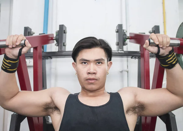 Portrait Athletic Young Man Flexing Chest Muscles Gym Machine — Stock Photo, Image